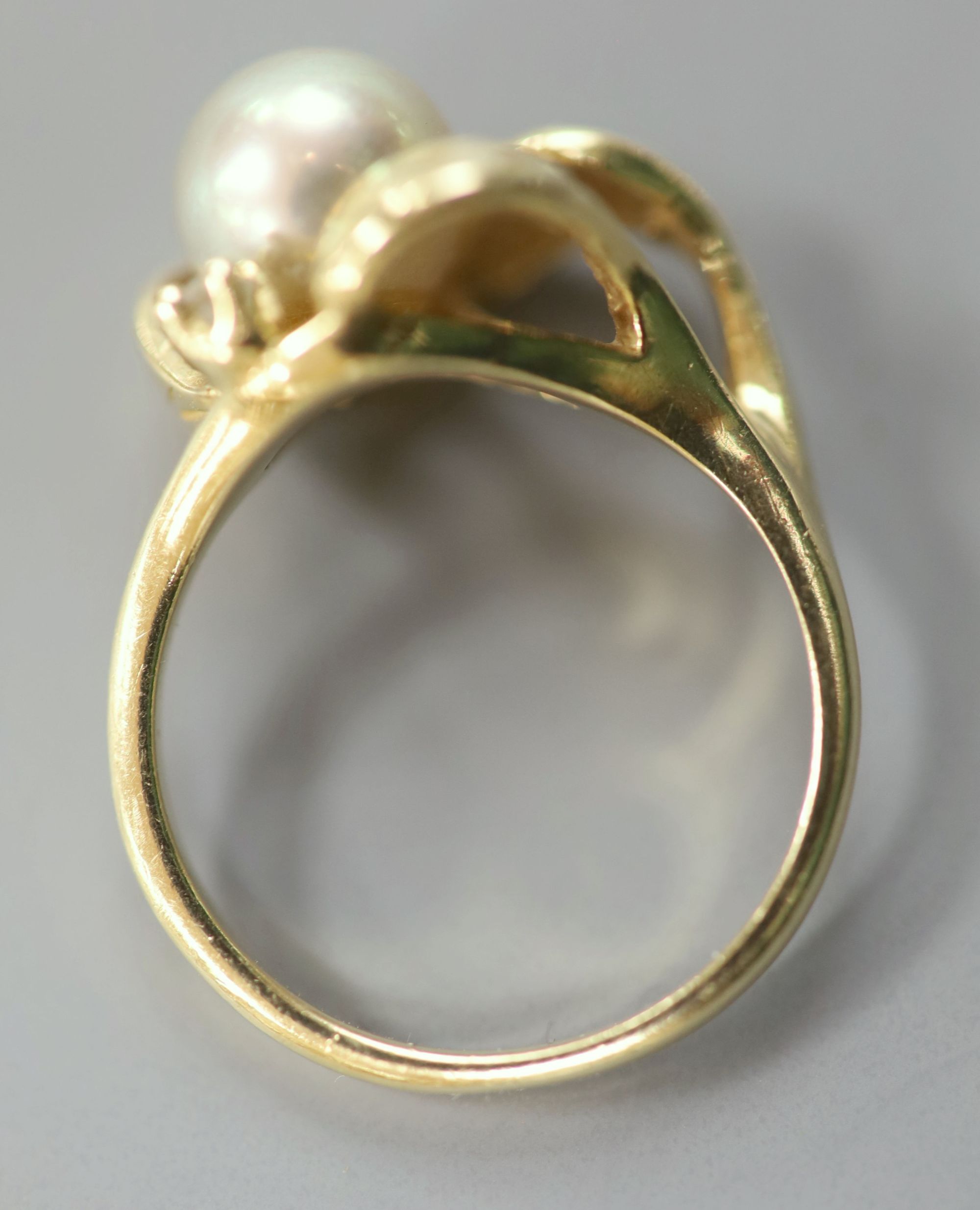 A modern yellow metal (stamped 14k), cultured pearl and diamond chip set dress ring, & pair of earstuds.